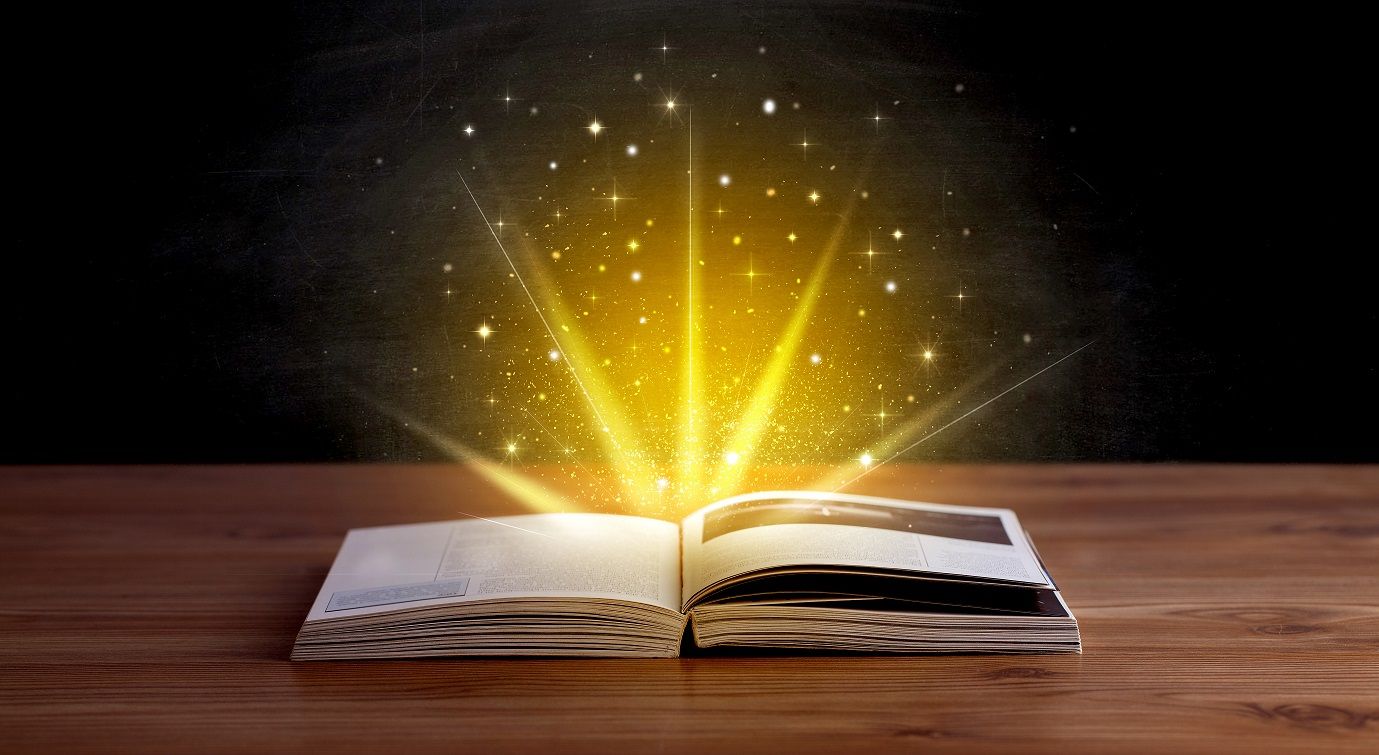 Yellow,Lights,And,Sparkles,Coming,From,An,Open,Book